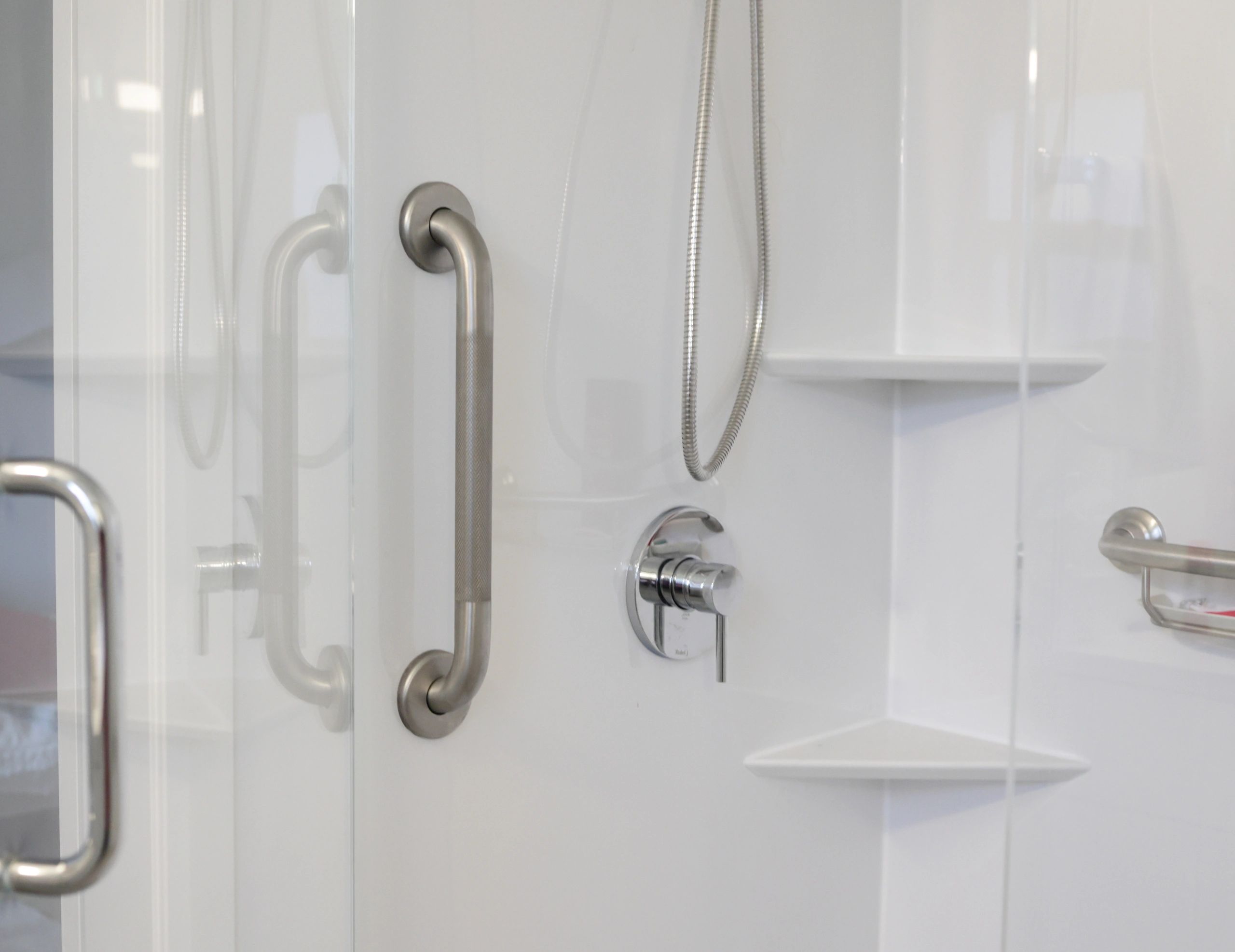 Residential shower stall with glass enclosure