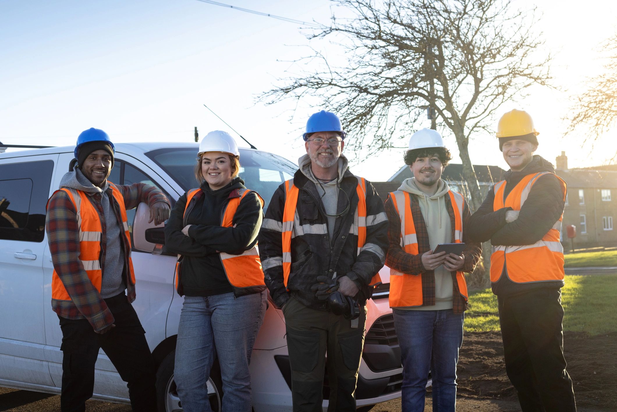 Glass service team standing together on a job site