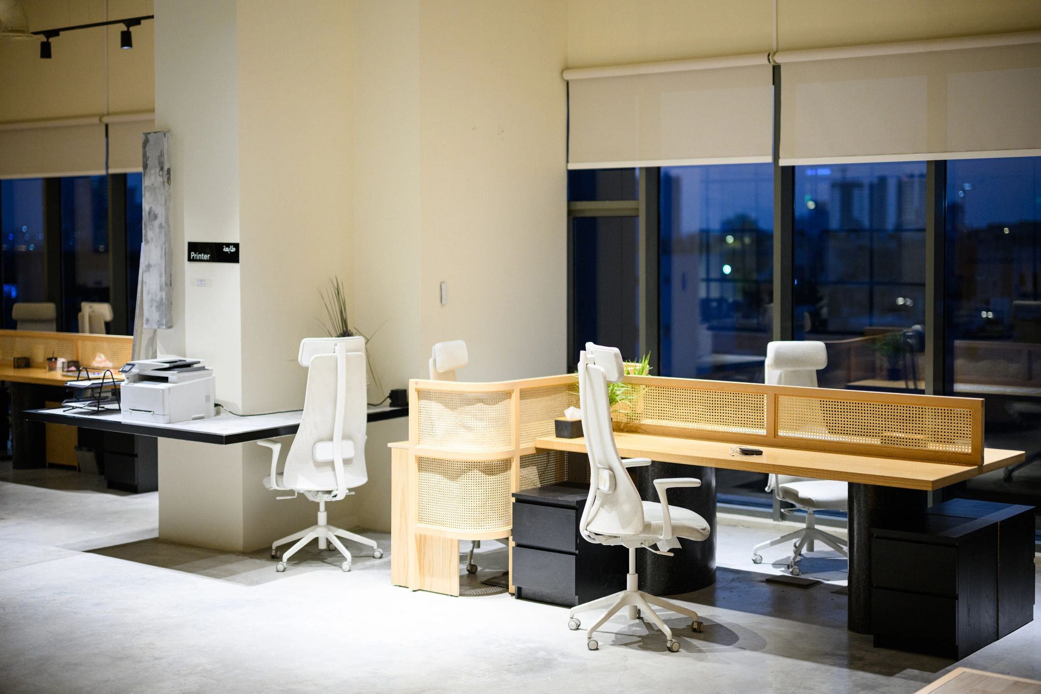 Modern office interior with glass-partitioned workspace